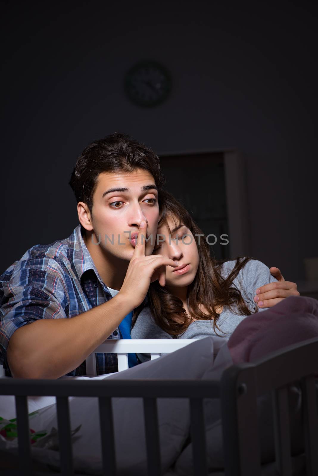 Young parents sleepless with newborn baby at night