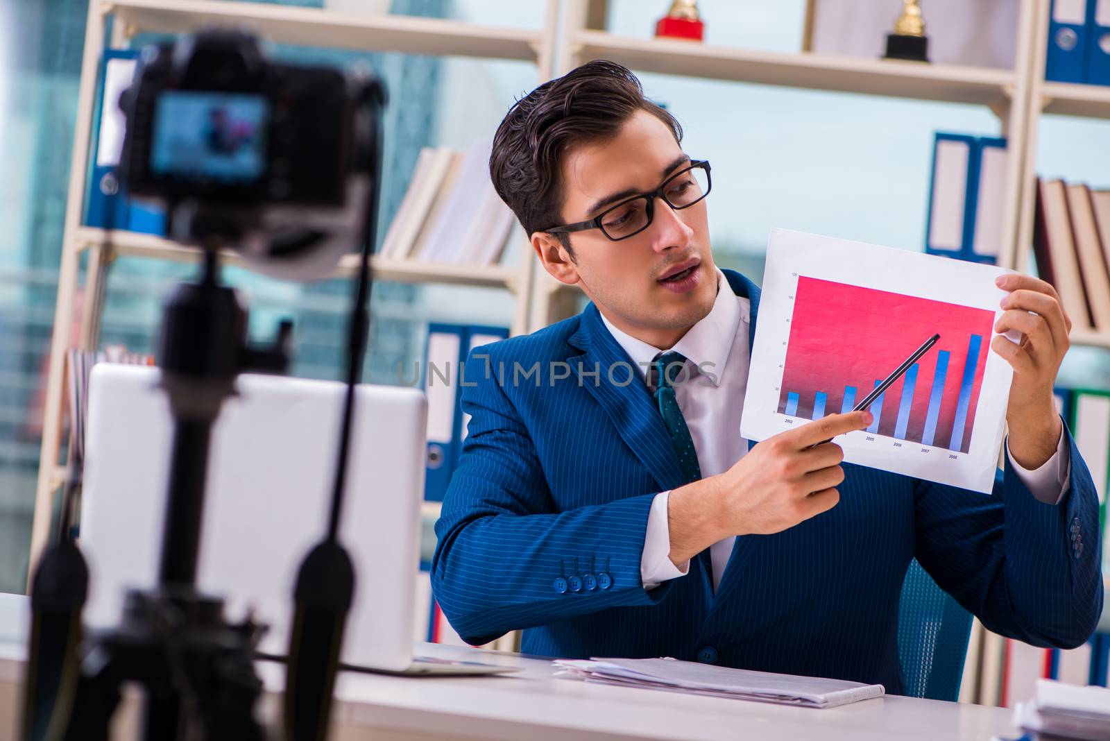 Businessman recording a video for vlog
