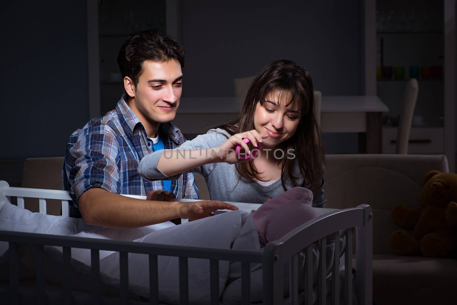 Young parents sleepless with newborn baby at night