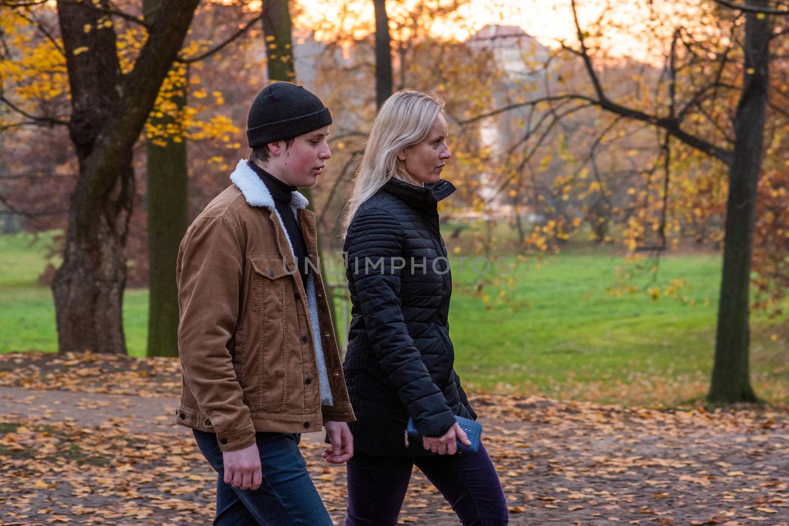 14/2020. Park Stromovka. Prague czech Republic. Mother and son walking in the park on a Sunday winter day.
