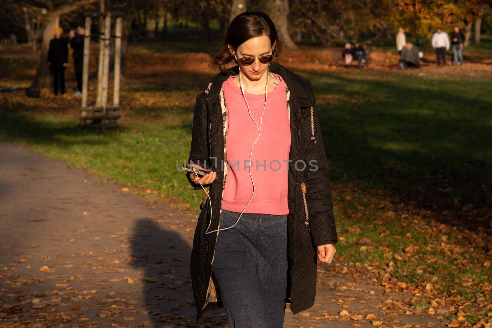 11/14/2020. Park Stromovka. Prague czech Republic. A woman is walking in the park on a Sunday winter day.