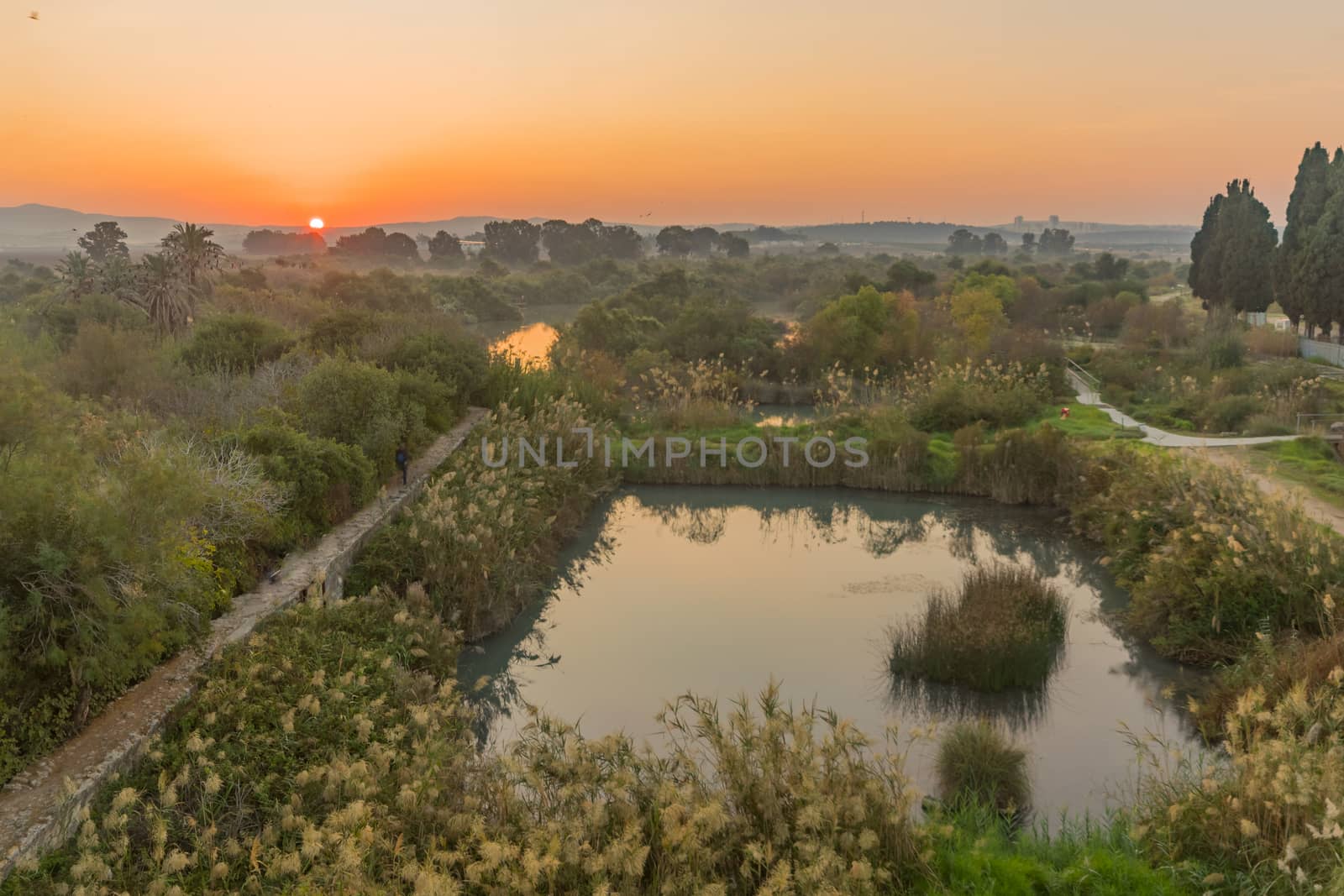 Sunrise view over wetland and ancient canal system, in En Afek nature reserve, northern Israel