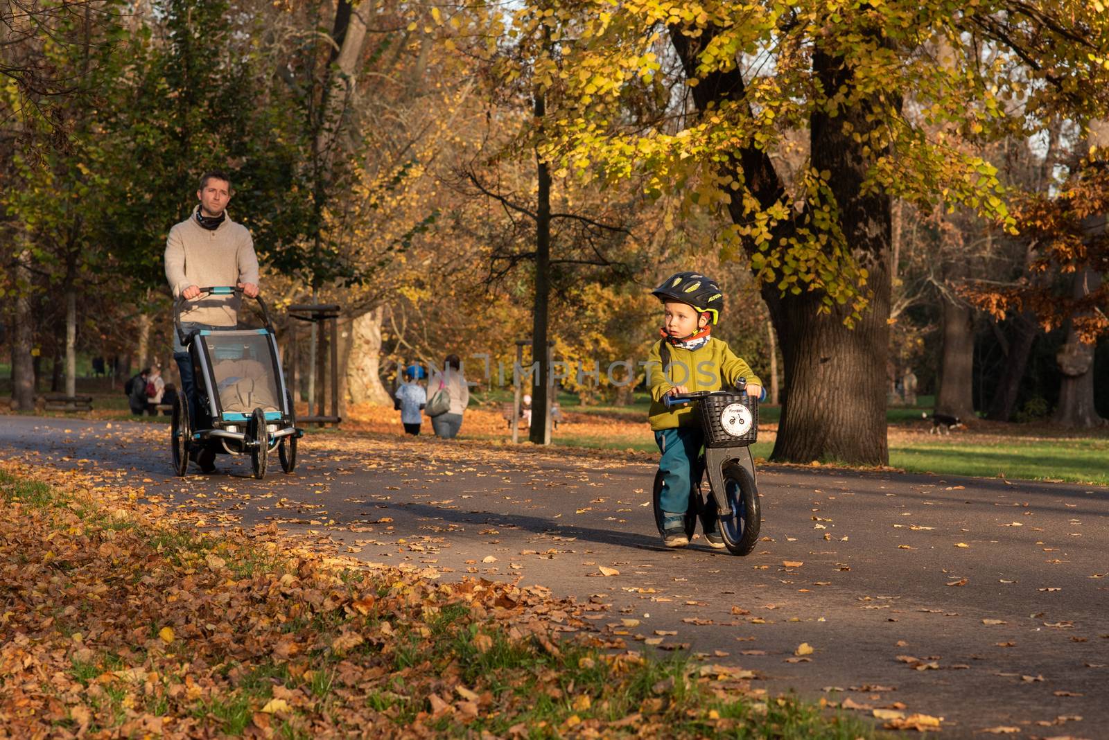 11/14/2020. Park Stromovka. Prague czech Republic. A kid is riding his motorbike in the park on a Sunday winter day. by gonzalobell