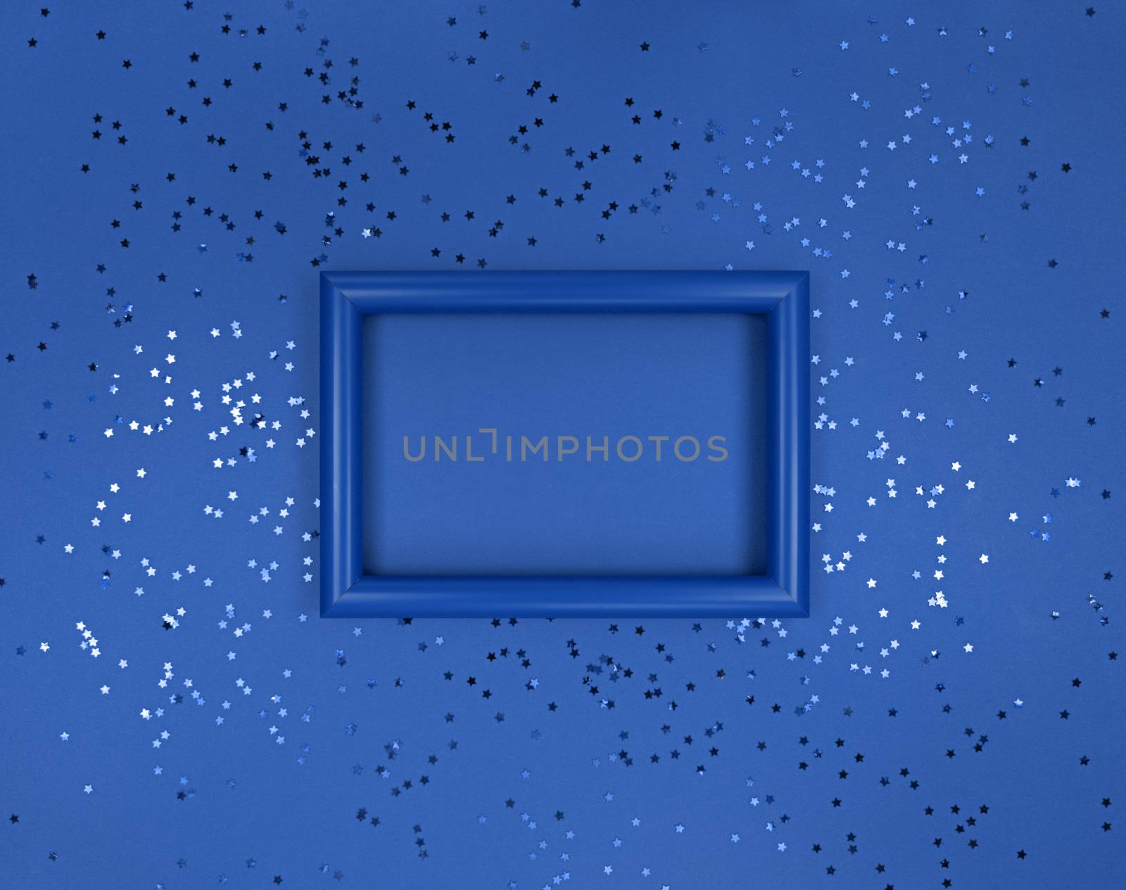 Frame and confetti stars on navy blue background.