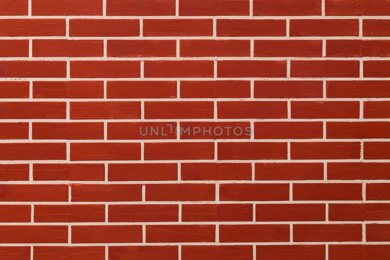 Brick red on wall background.