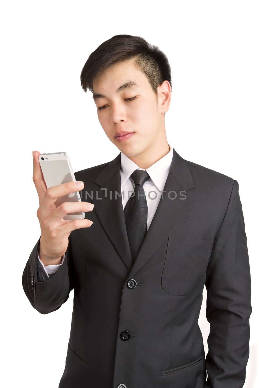 Young Businessman calling by phone. Isolated on white background by jayzynism