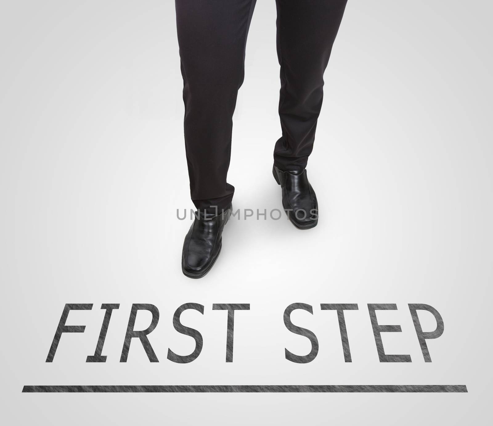 Businessman standing wearing court shoes on first step line. by jayzynism