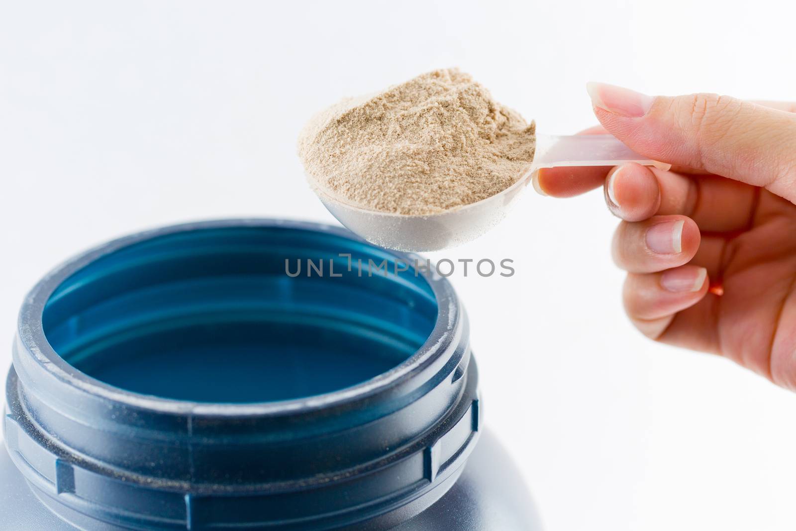 The hand raise a spoon measure Whey protein chocolate powder for by jayzynism