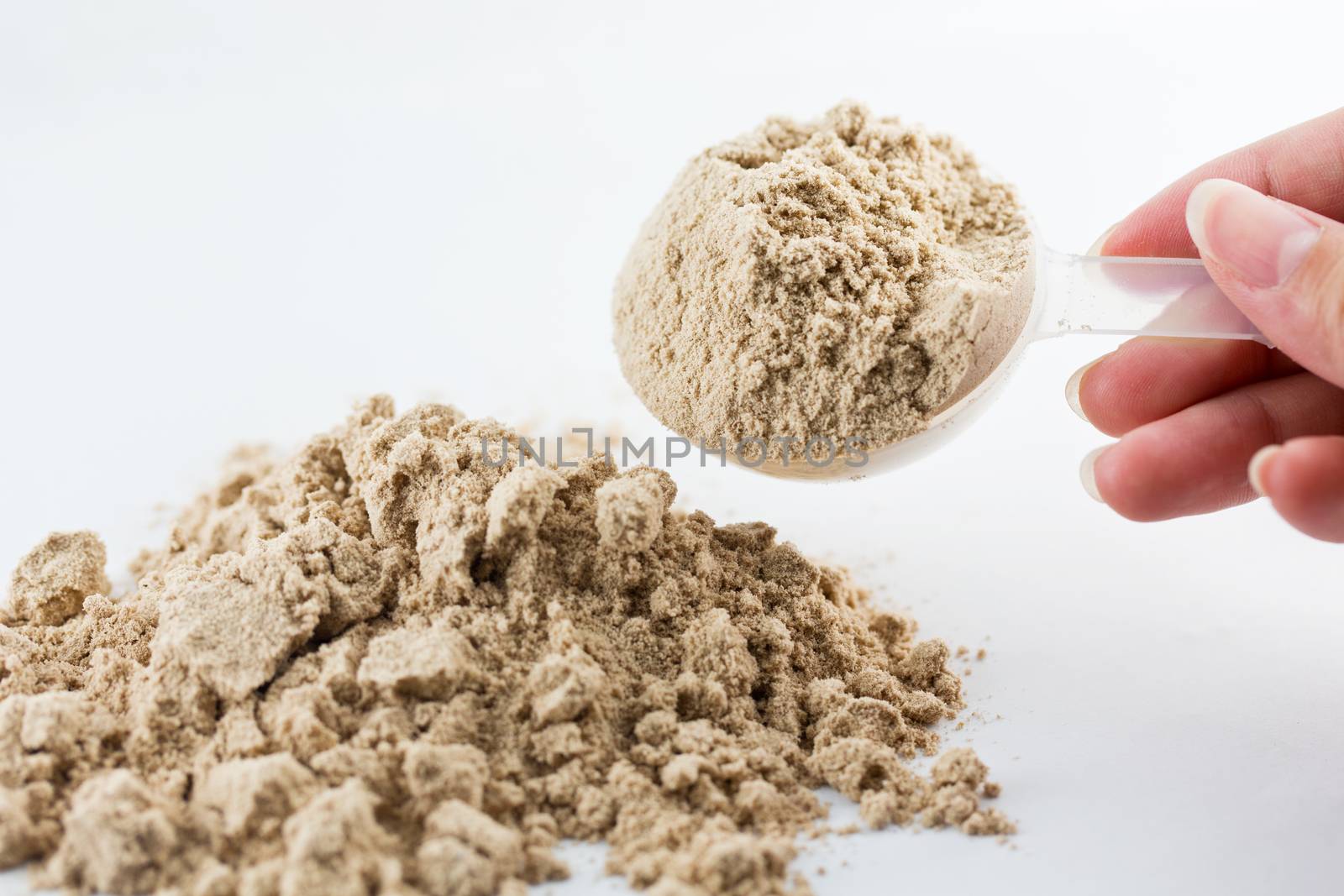 The hand raise a spoon measure Whey protein chocolate powder for by jayzynism