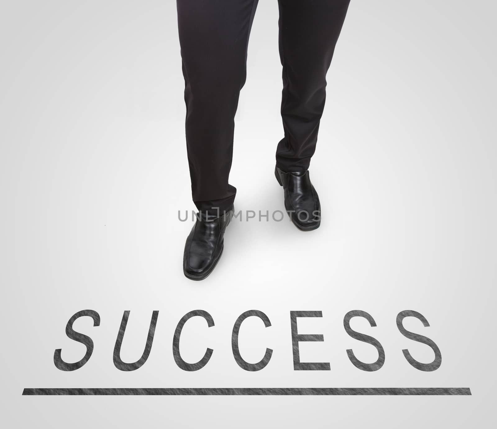 Businessman standing wearing court shoes on success line. by jayzynism