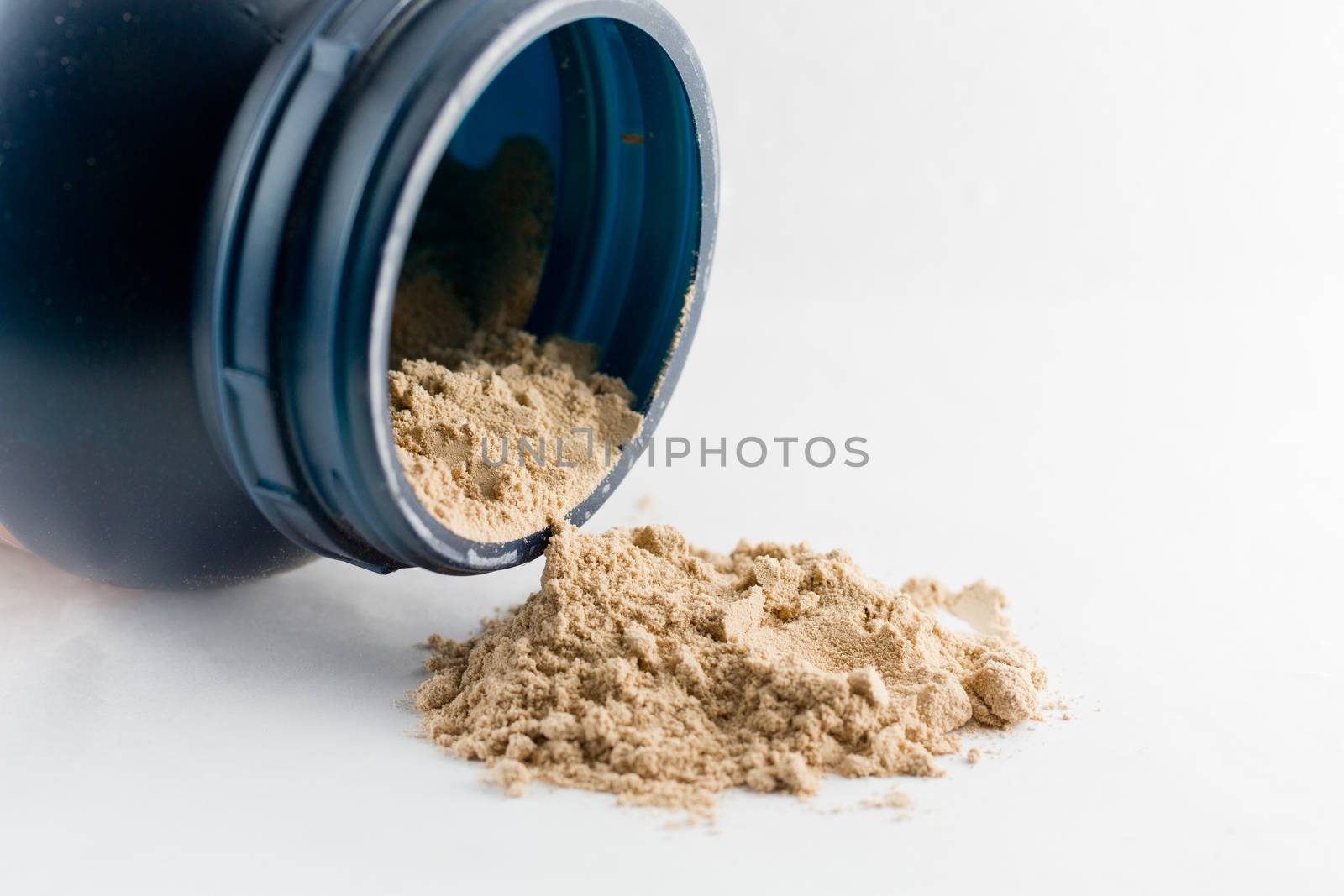 Whey protein chocolate powder isolated on white background. by jayzynism