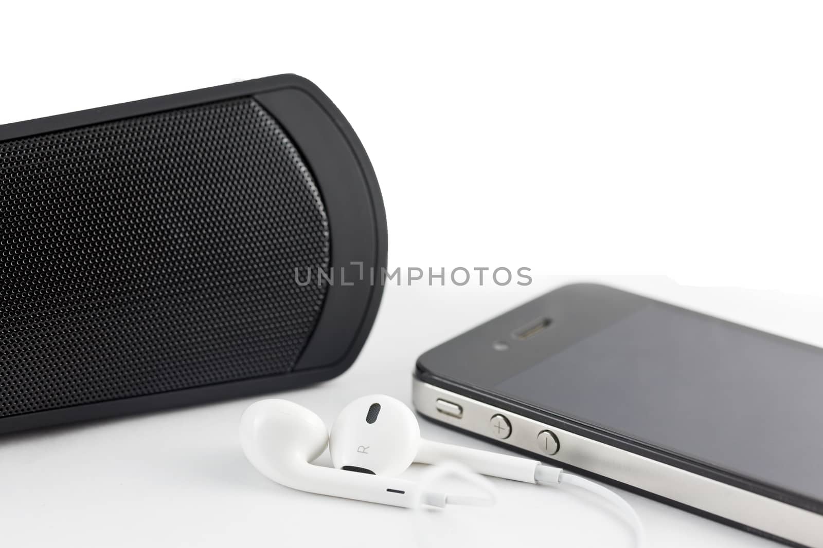 White Earphone , woofer and Smartphone equipment set isolated on by jayzynism