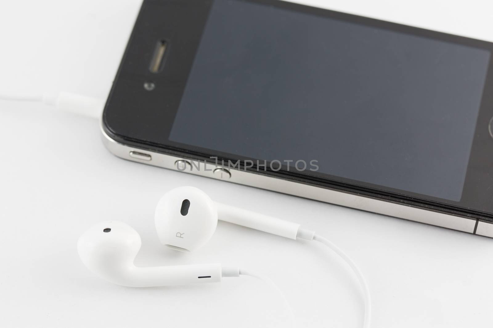 White Earphone and Smartphone equipment set isolated on white background : iPhone