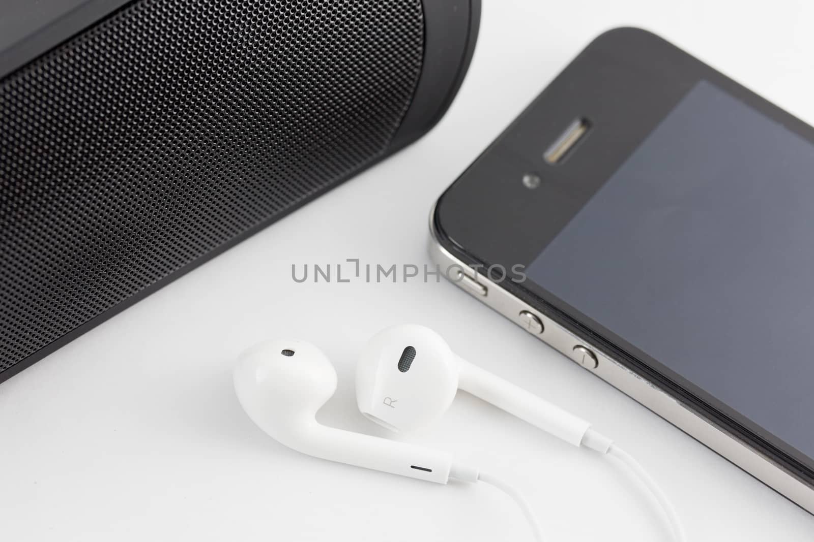 White Earphone , woofer and Smartphone equipment set isolated on by jayzynism