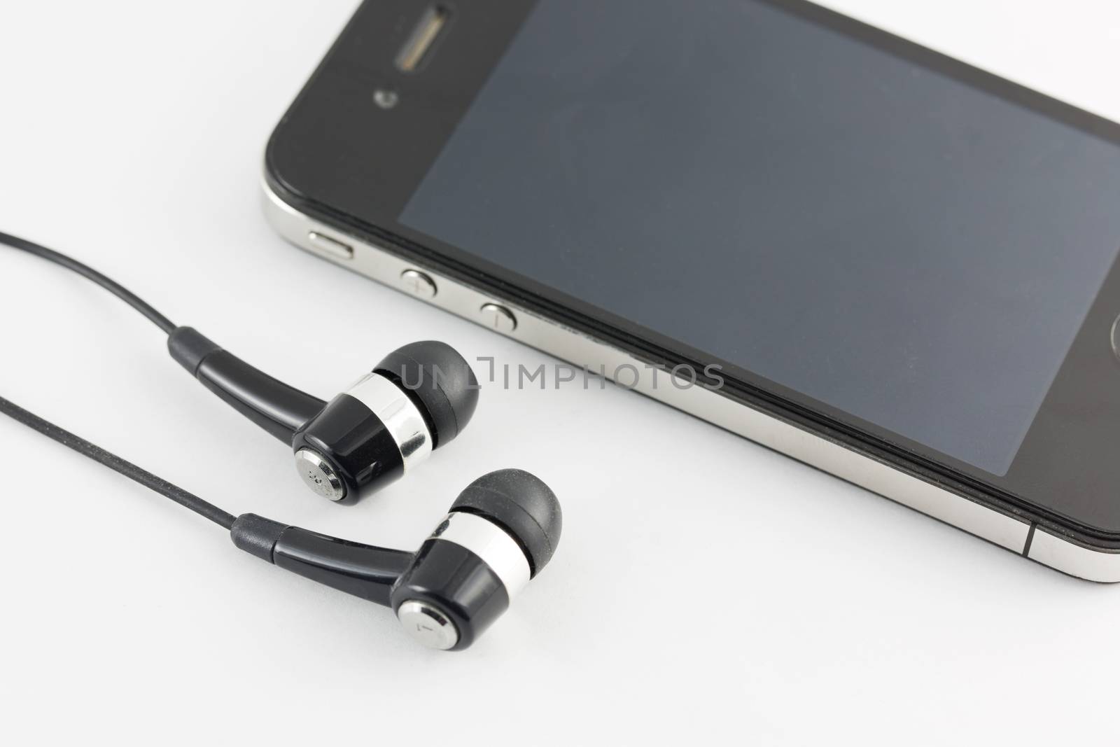 Black Earphone and Smartphone equipment set isolated on white background : iPhone