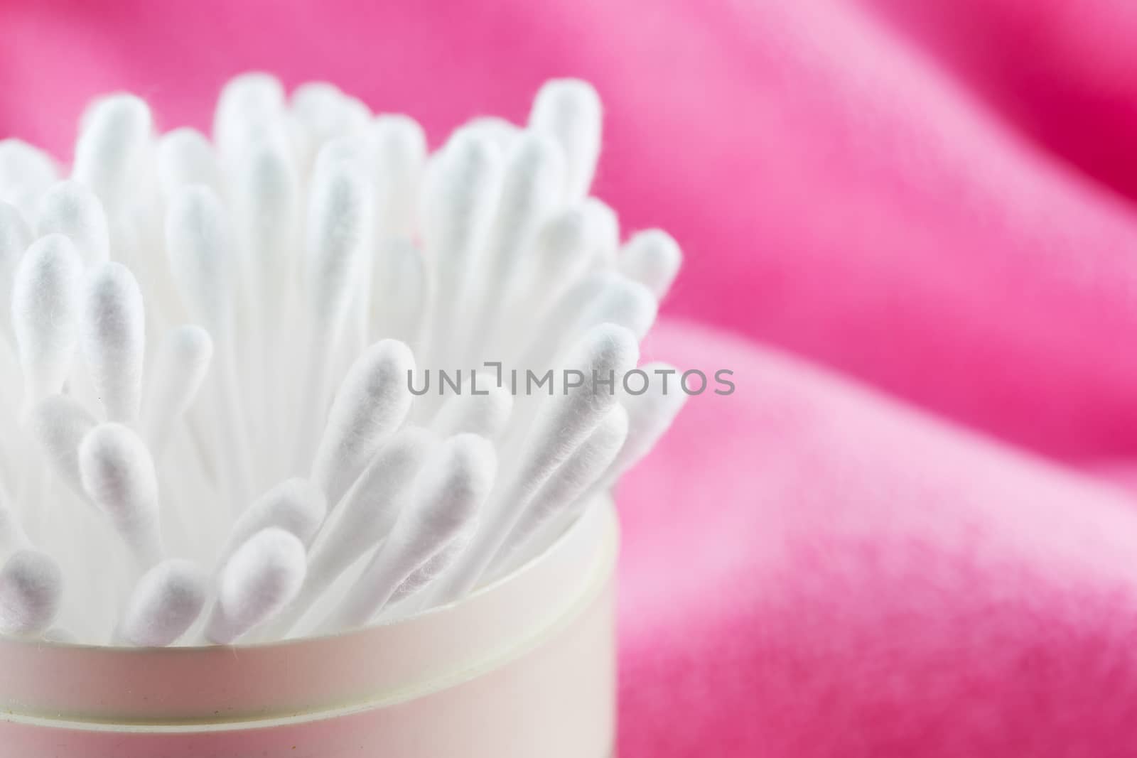 Close up of cotton Buds isolated on pink background : swab swab by jayzynism