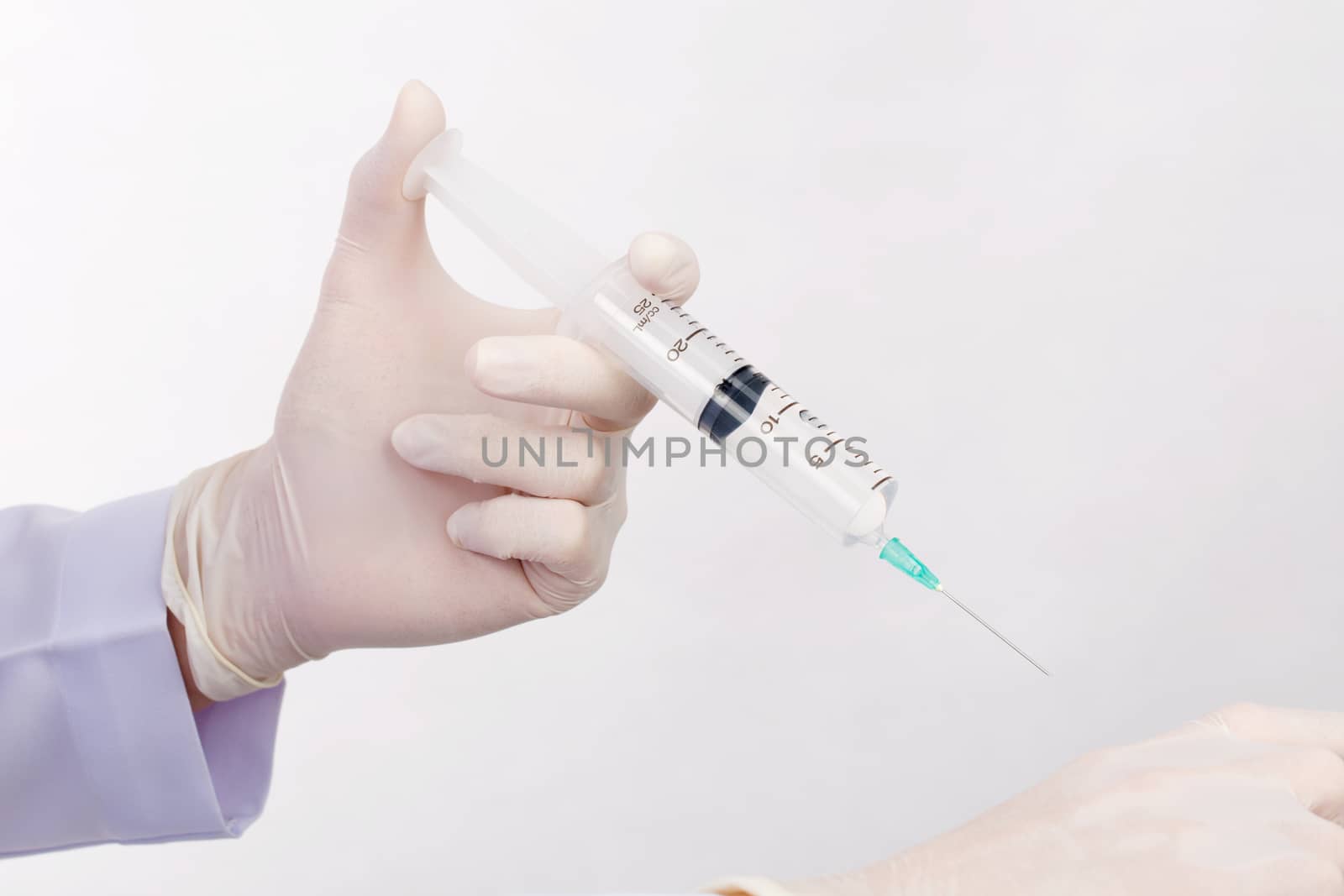 Doctor demonstrate inject saline solution patient isolated on wh by jayzynism