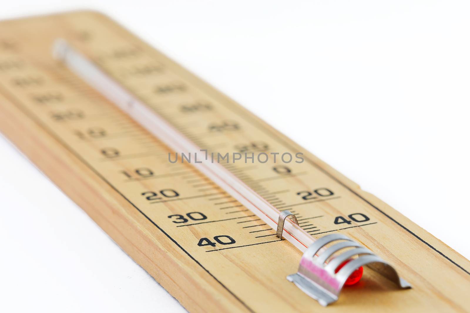 Close-up wooden thermometer scale isolated white background.