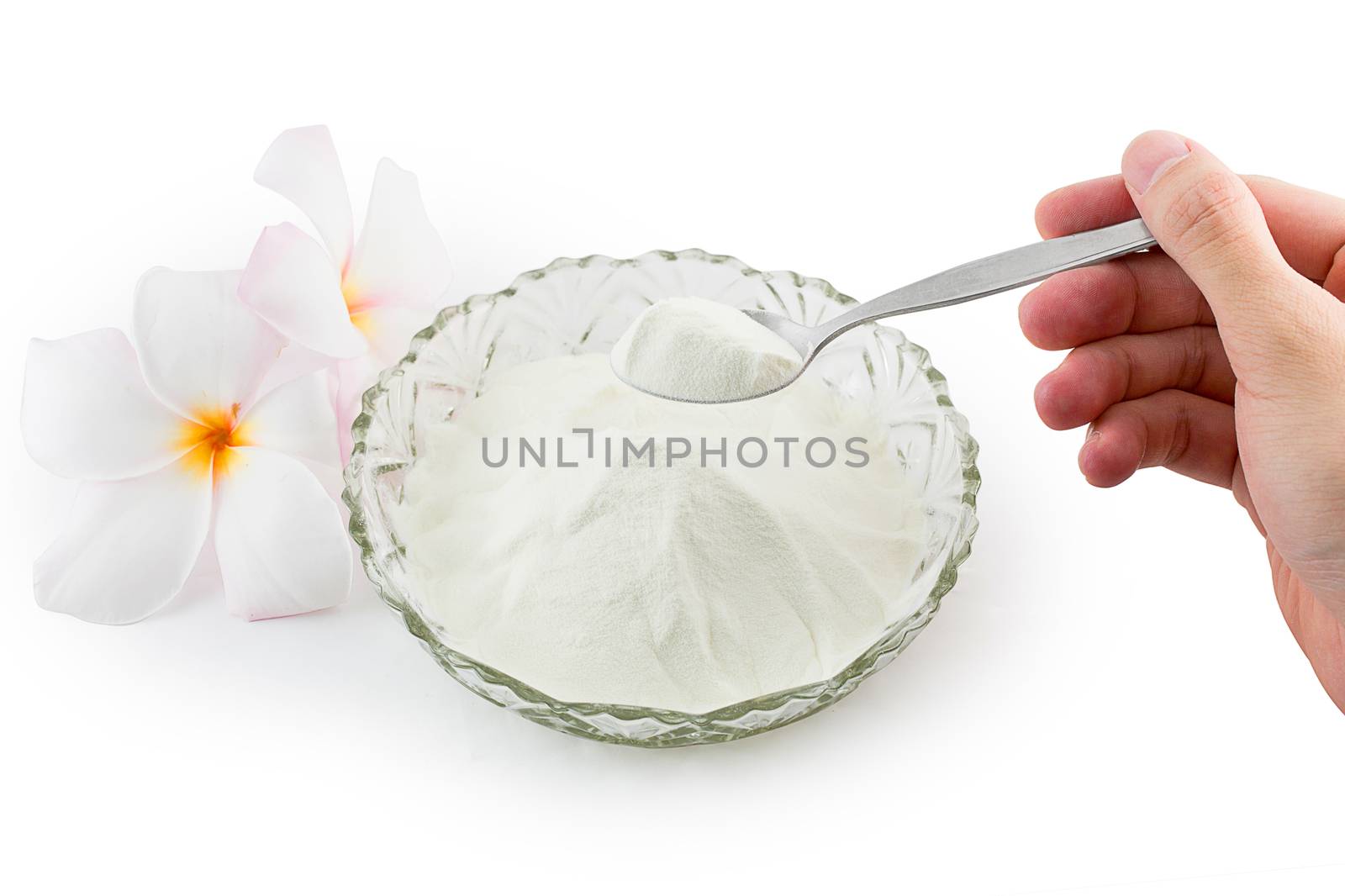 Collagen powder protein on spoon measure isolated on white background.