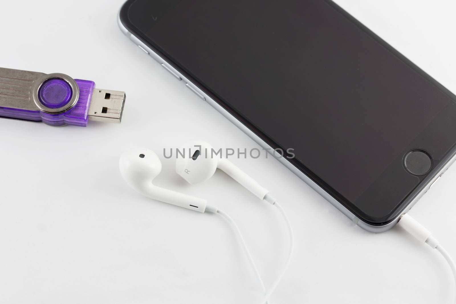 White Earphone and Smartphone equipment set isolated on white ba by jayzynism