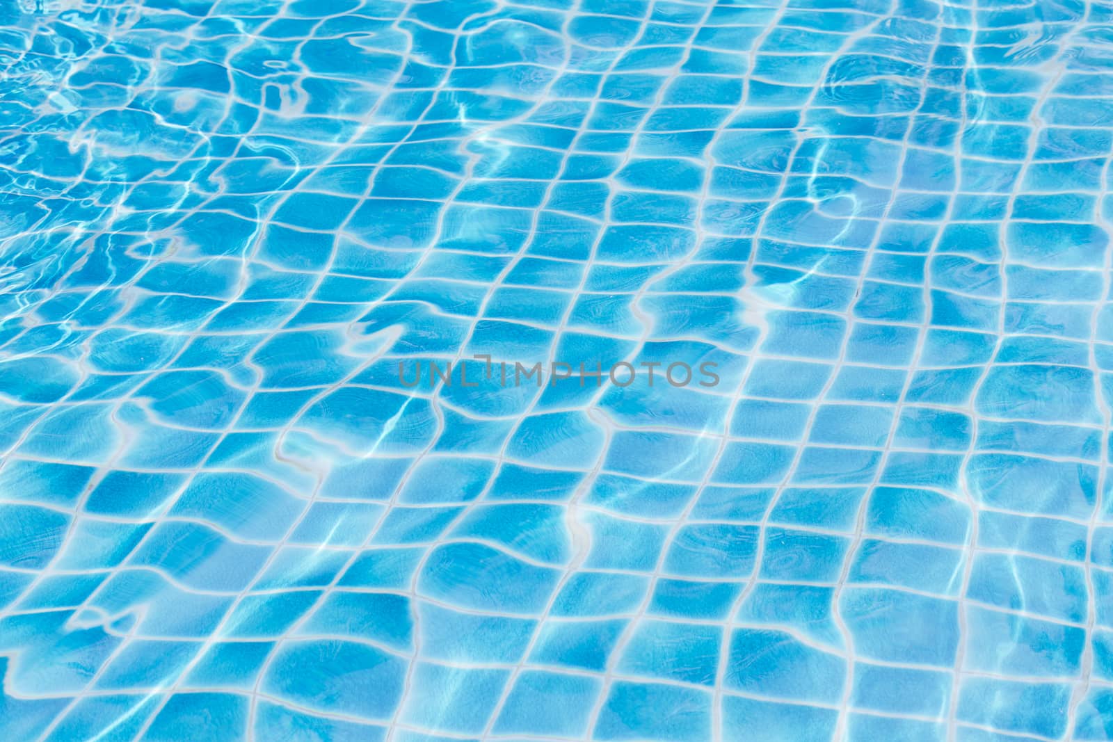 Blue sky swimming pool water texture reflection. by jayzynism