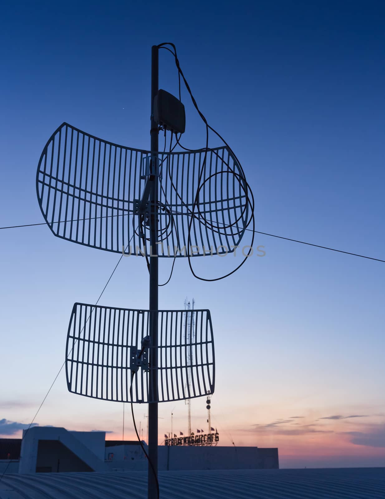 Antenna silhouette on sunset.