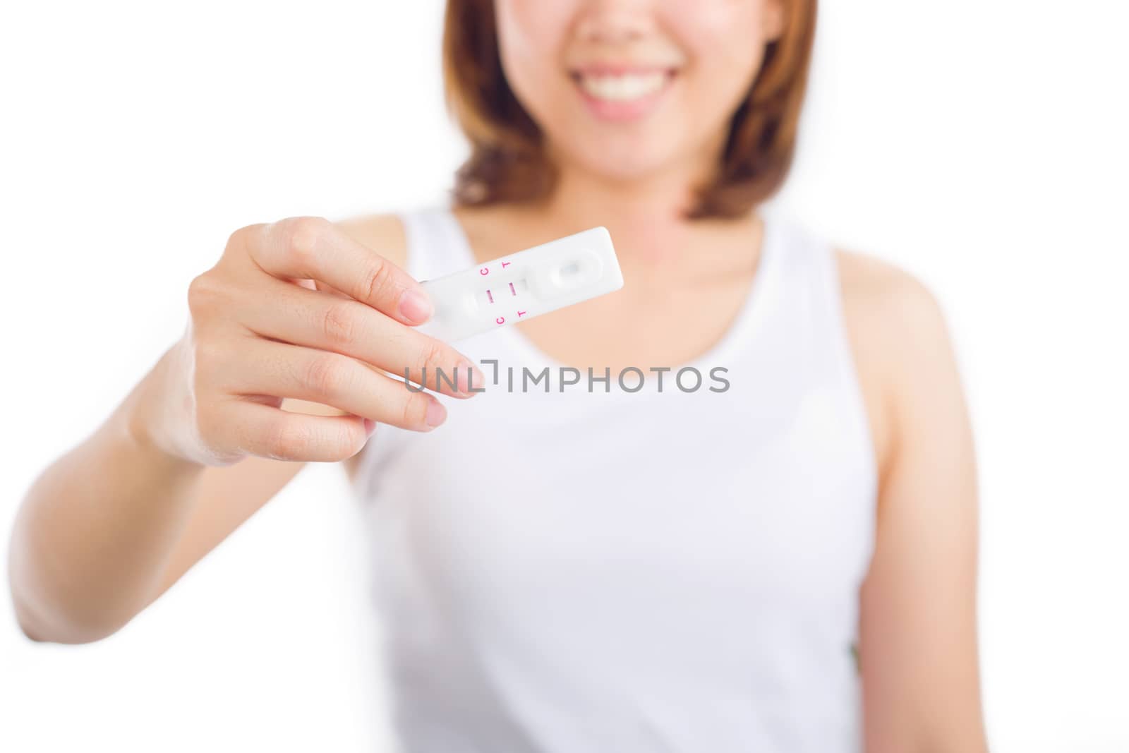 Young women holding pregnancy test feeling happiness. by jayzynism