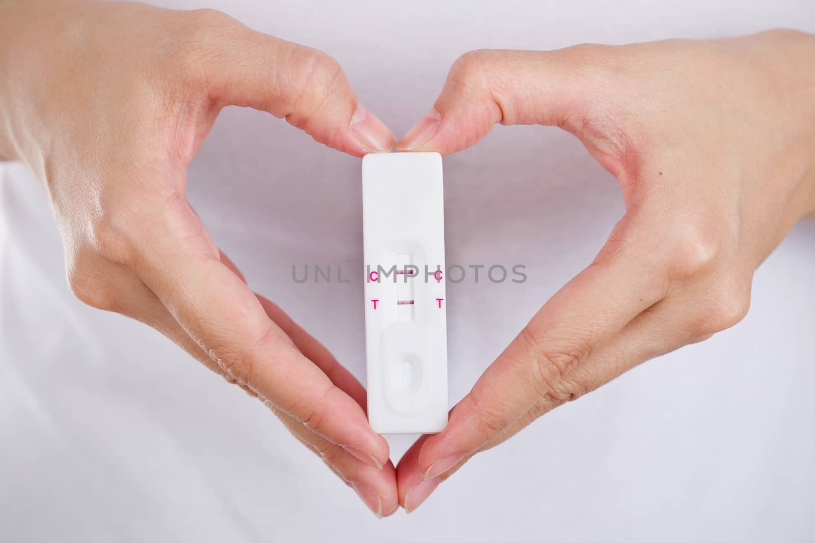 Close up pregnancy test with love women feeling happiness.