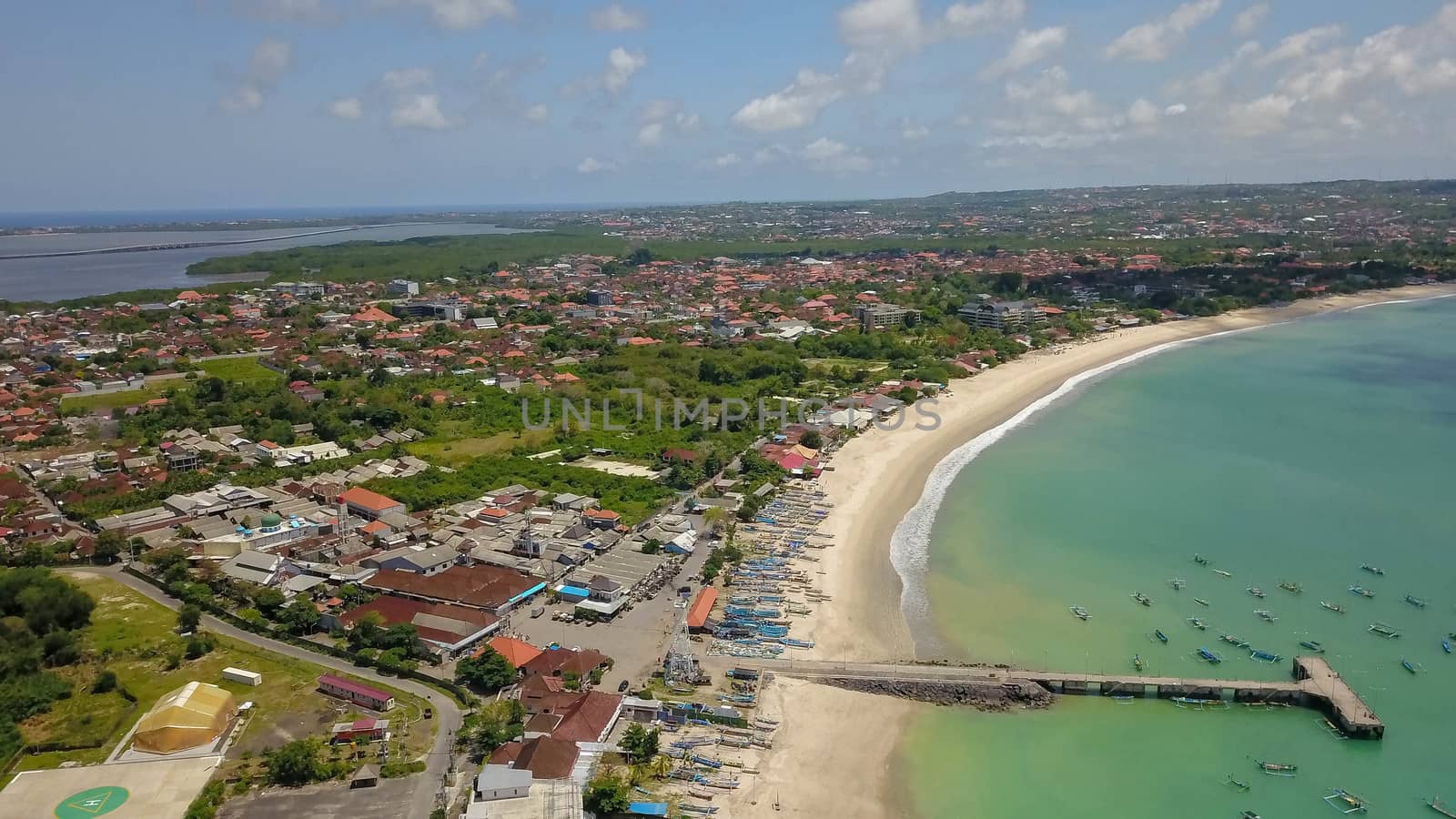 Aerial Drone Flight above Turquoise Crystal Ocean Water, Harbor, Port, Pier in Bright Sunny Day Light. Travel Transport Relax Tourism Concept. Tropical Paradise Bali Island, Indonesia. Cinematic.