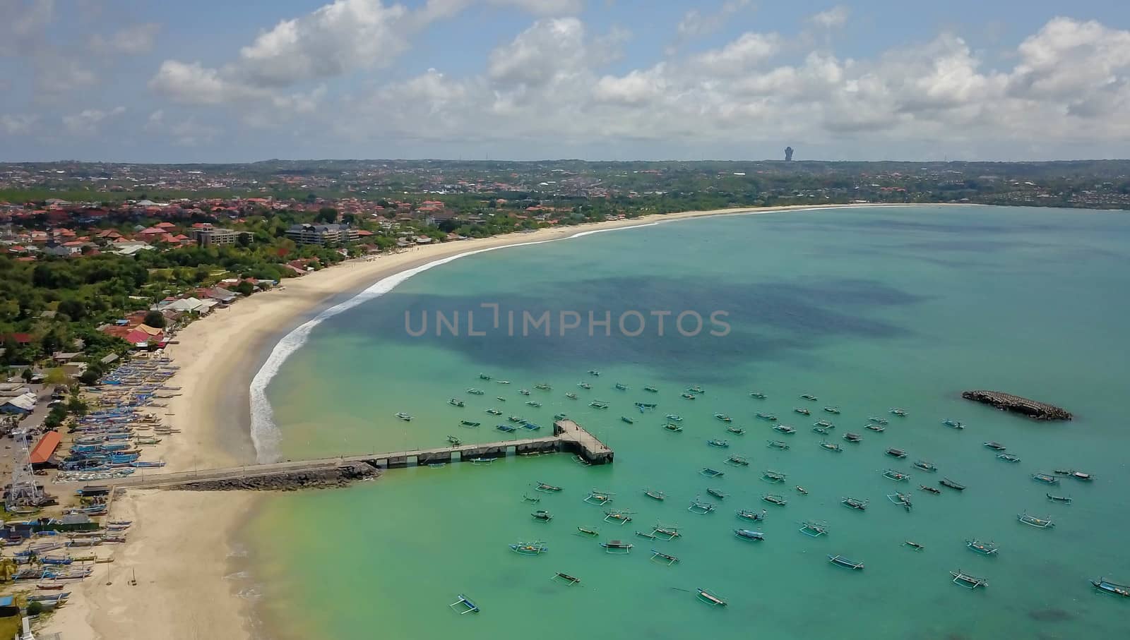 Aerial Drone Flight above Turquoise Crystal Ocean Water, Harbor, Port, Pier in Bright Sunny Day Light. Travel Transport Relax Tourism Concept. Tropical Paradise Bali Island, Indonesia. Cinematic.