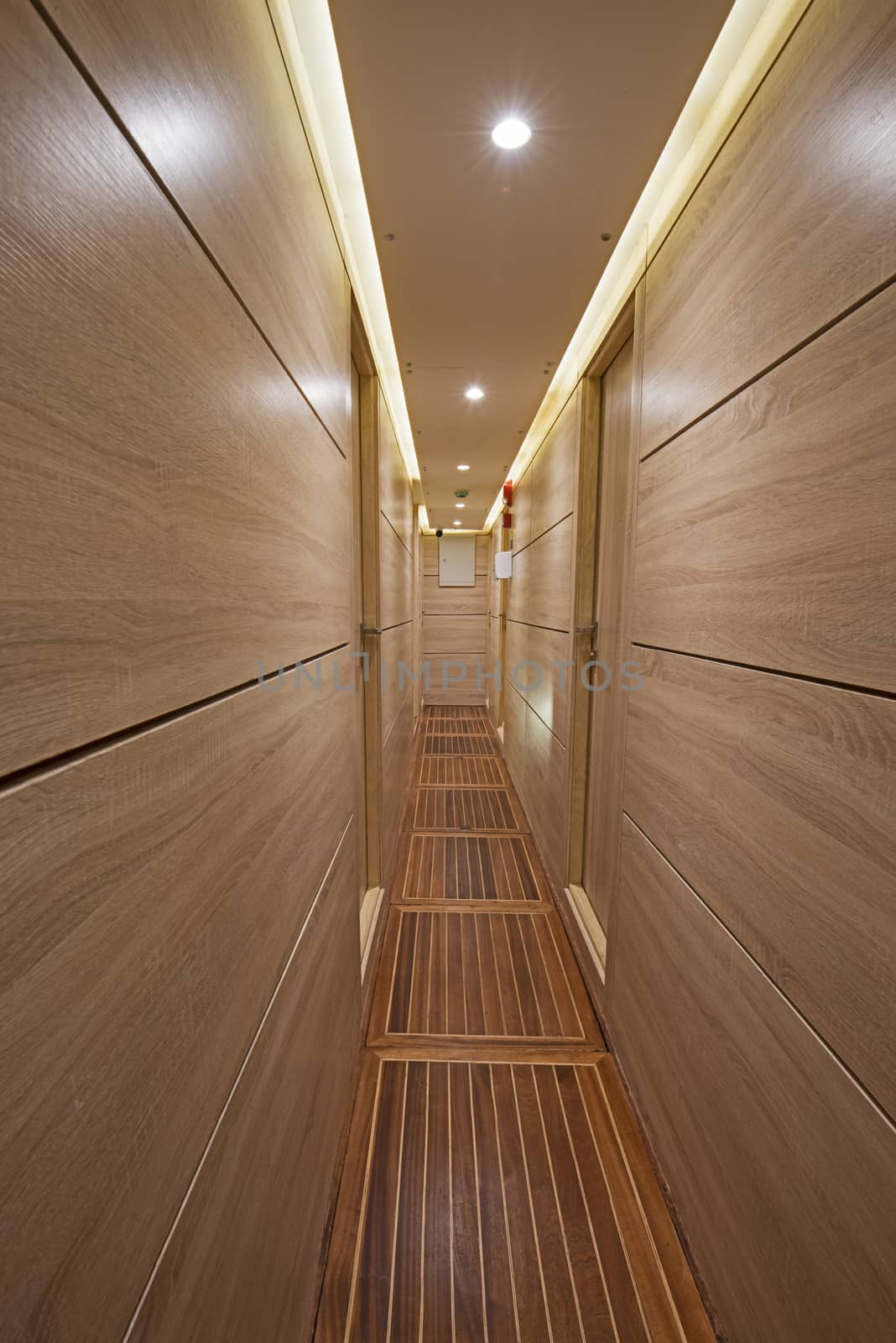 Interior of corridor area of luxury motor yacht by paulvinten