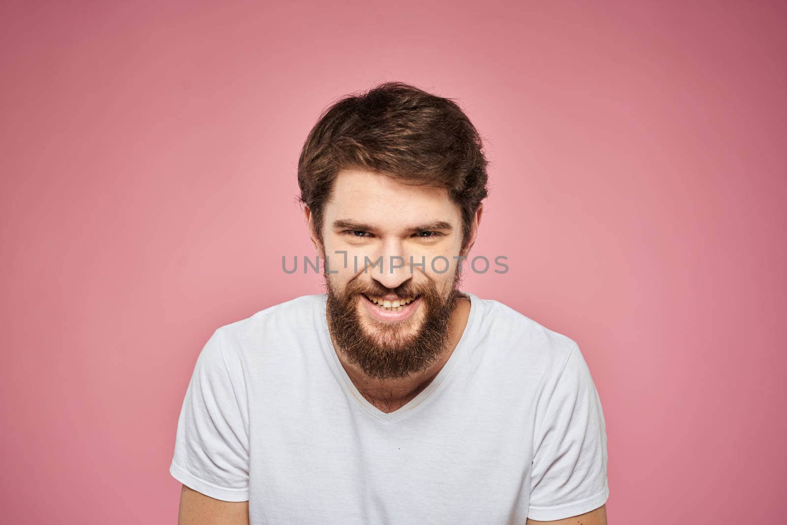 cheerful bearded man white t-shirt emotions cropped view pink background by SHOTPRIME