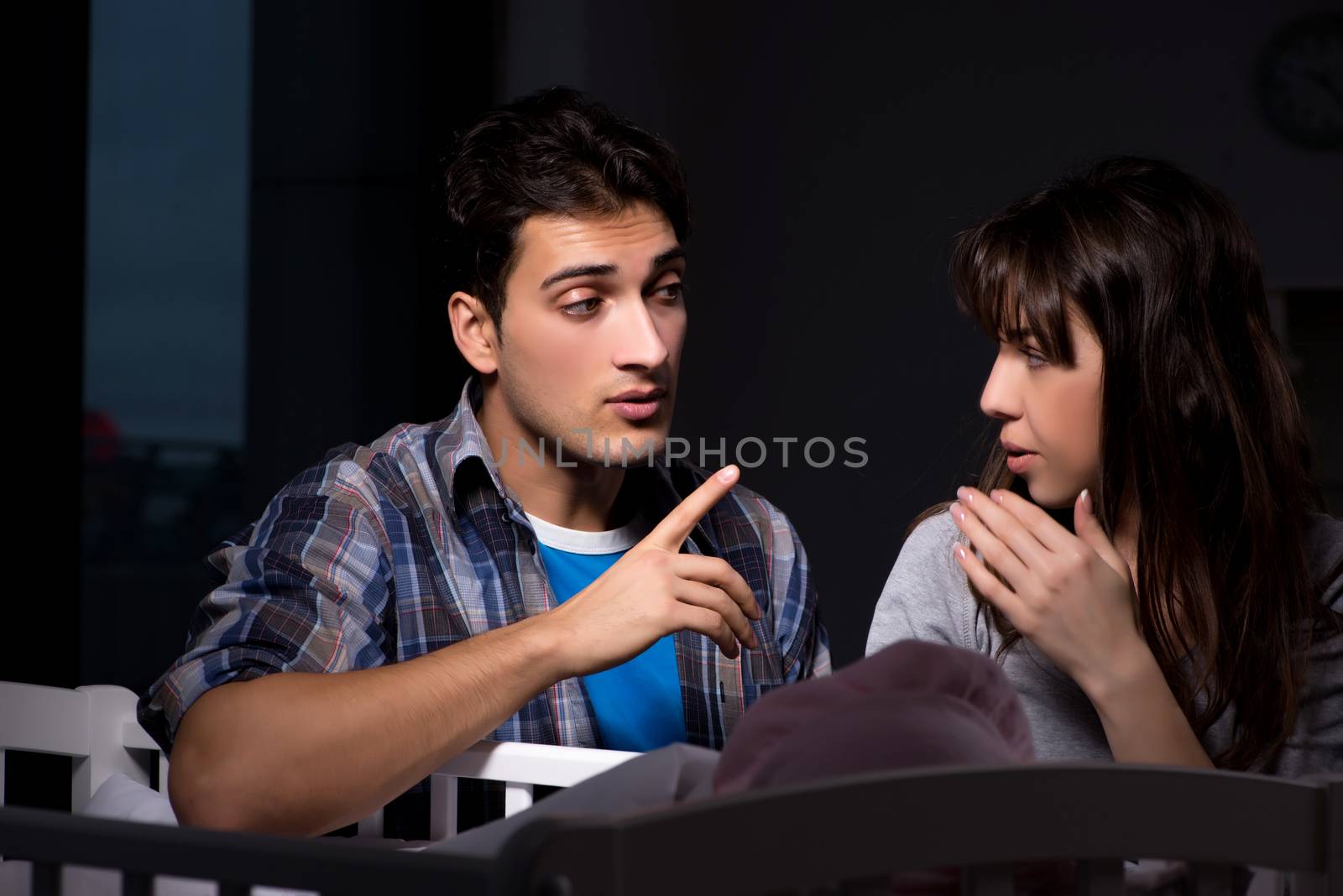 Young parents sleepless with newborn baby at night
