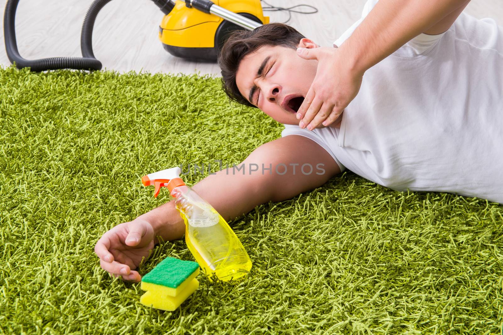 Young husband man cleaning floor at home