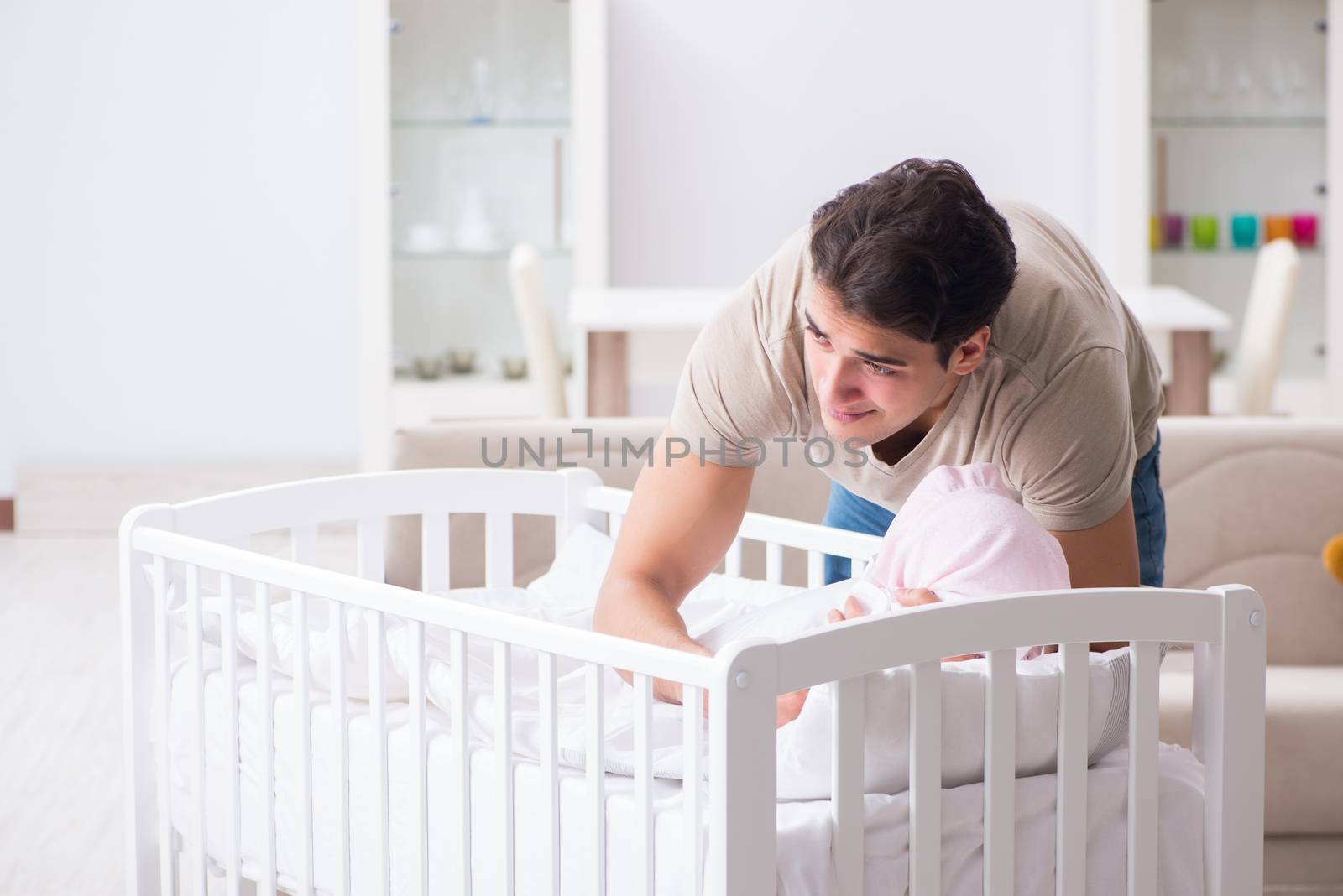 Young father dad frustrated at crying baby