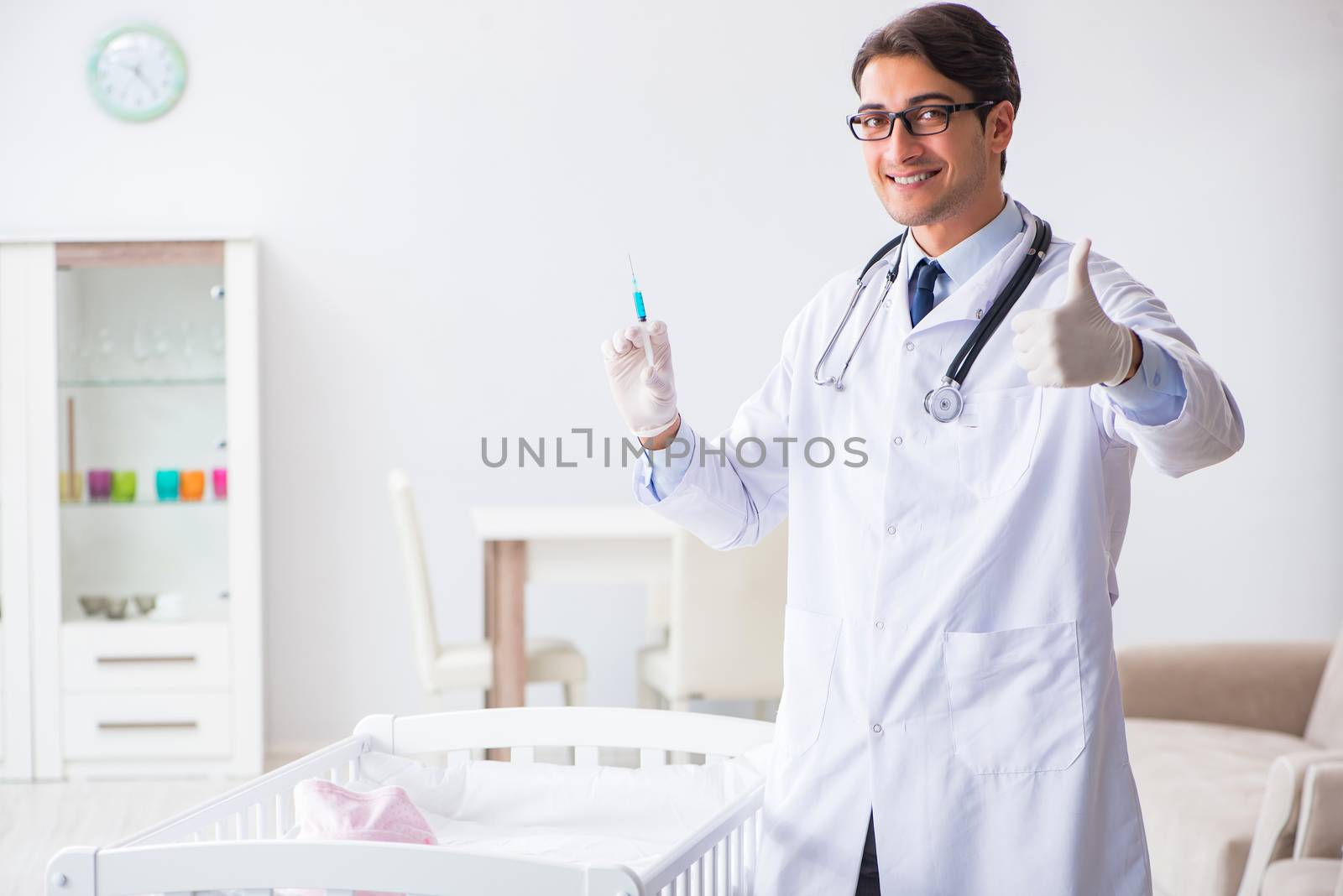 Doctor preparing for baby vaccination