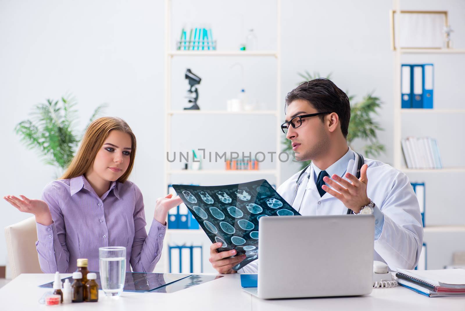Doctor examining x-ray images of patient