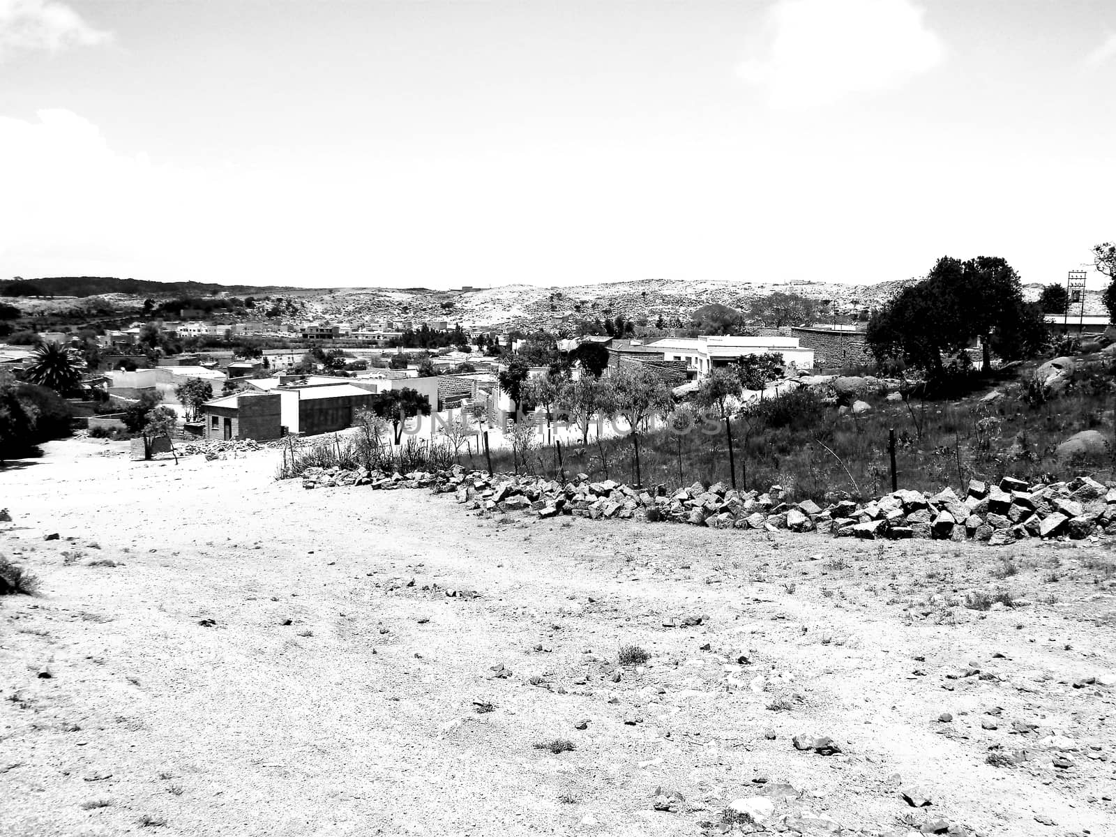 Tesseney, Eritrea - 10/11/2020: Beautiful photography of the landscape from the villages near the bord from Ethiopia. Old desert villages with some domestic animals.