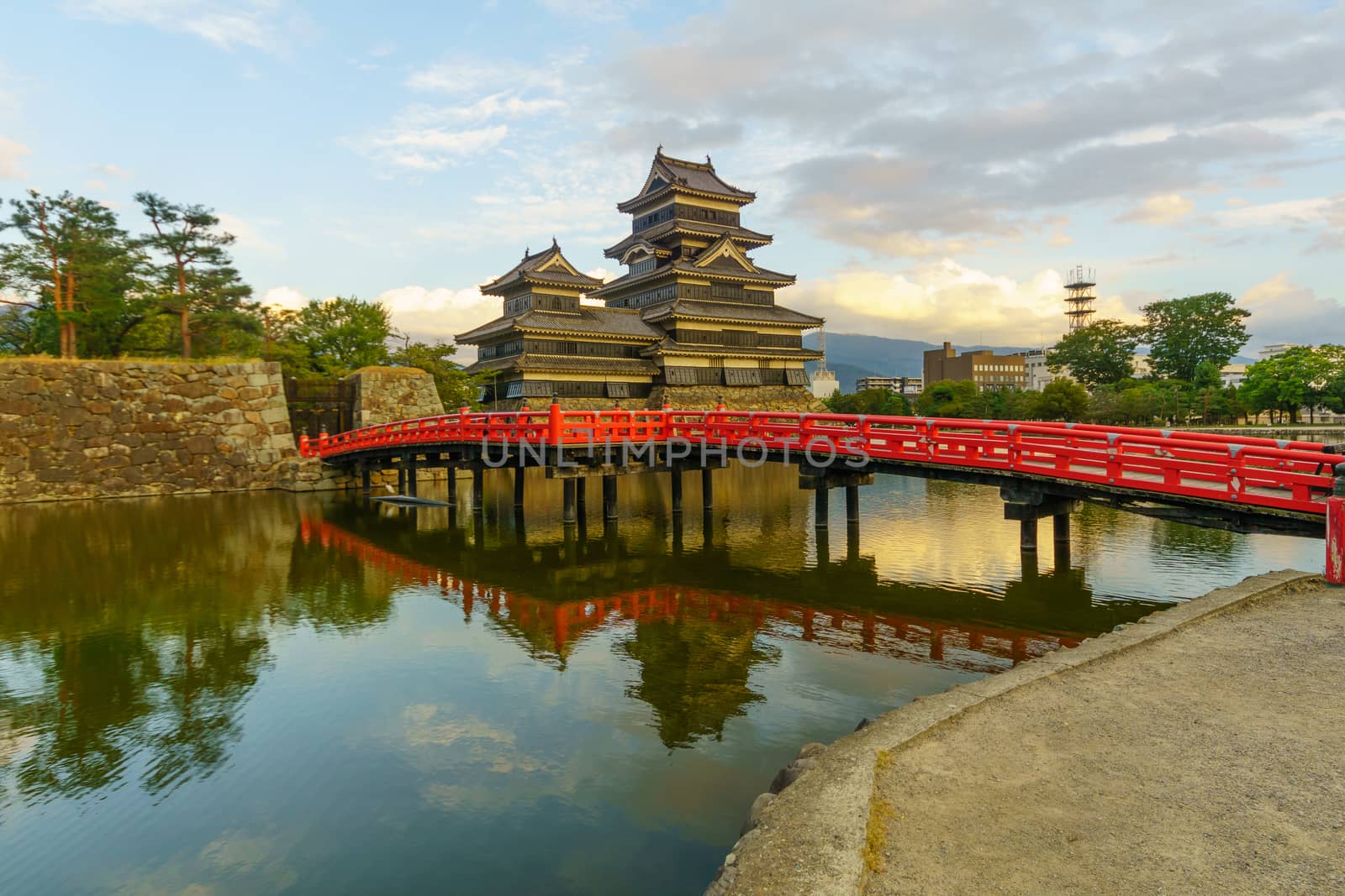 Sunset view of the Matsumoto Castle (or Crow Castle) and bridge, in Matsumoto, Japan