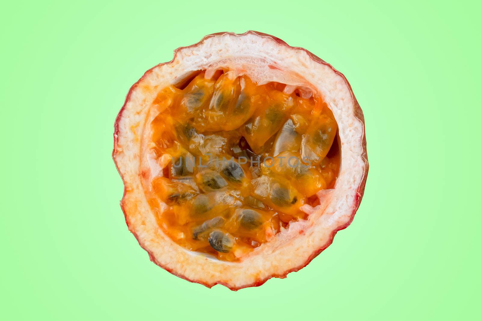 Maracuja cut in half and whole with leaf on green background. Passion fruit yellow with fruit juice and seeds. by Andreajk3