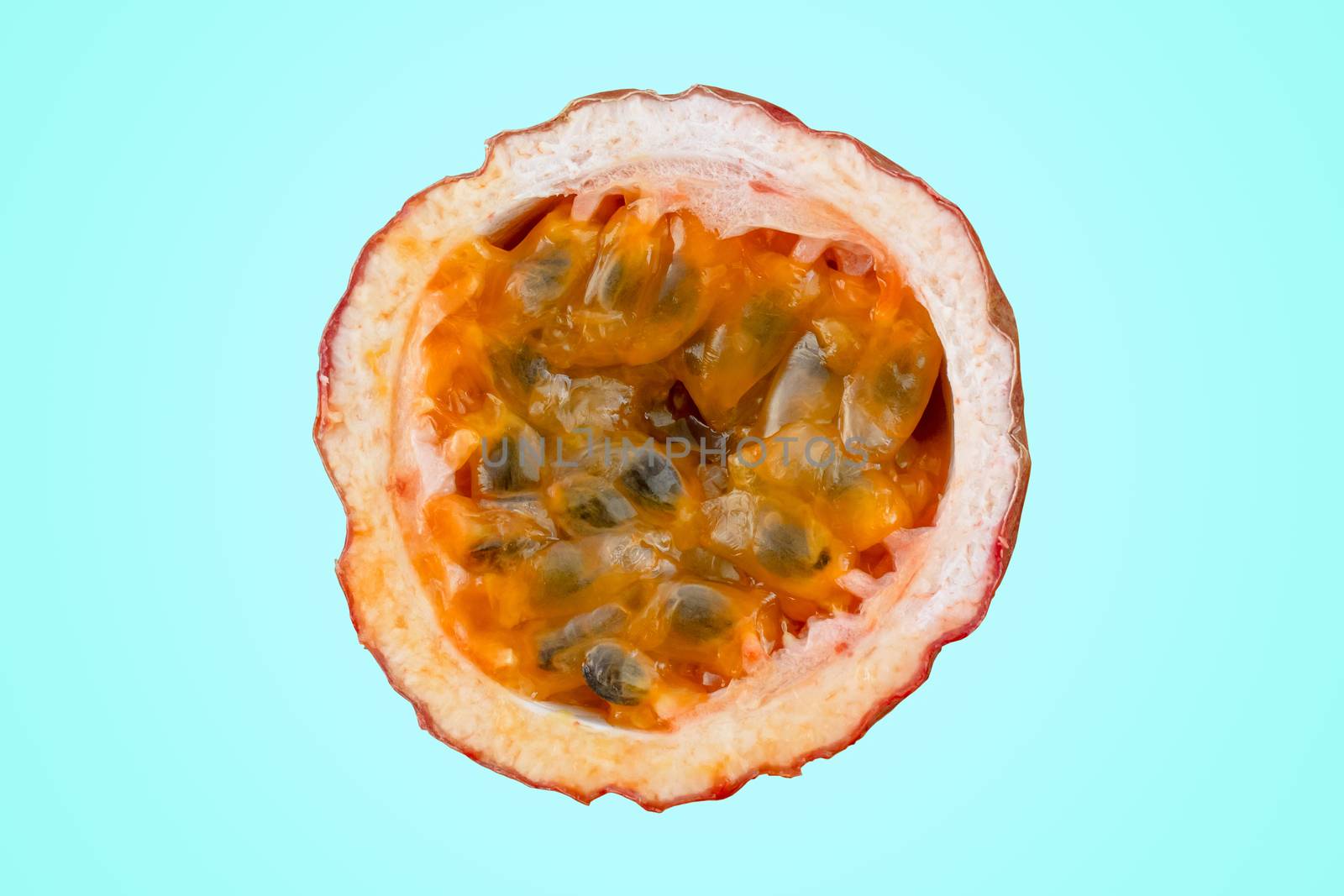 Maracuja cut in half and whole with leaf on azure background. Passion fruit yellow with fruit juice and seeds. by Andreajk3