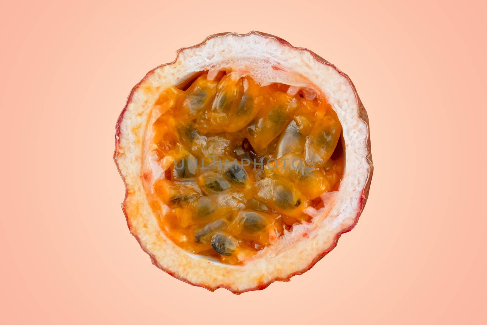 Maracuja cut in half and whole with leaf on orange background. Passion fruit yellow with fruit juice and seeds