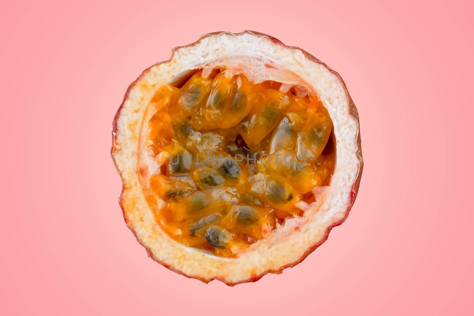 Maracuja cut in half and whole with leaf on red background. Passion fruit yellow with fruit juice and seeds