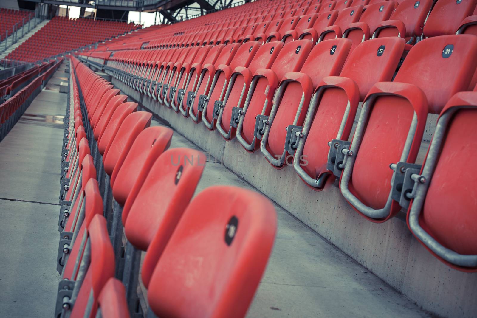 empty red seats in a football stadium