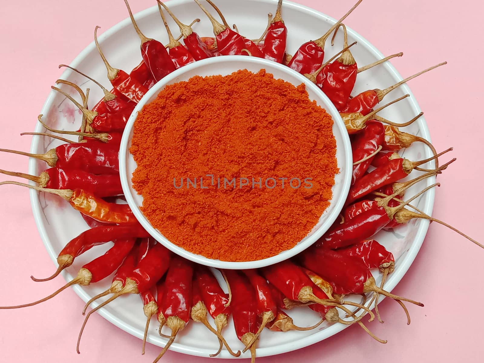 spicy and hot Red Dry Red Chilli stock and powder on bowl