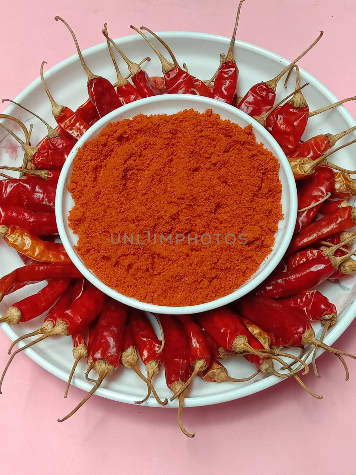 spicy and hot Red Dry Red Chilli stock and powder on bowl