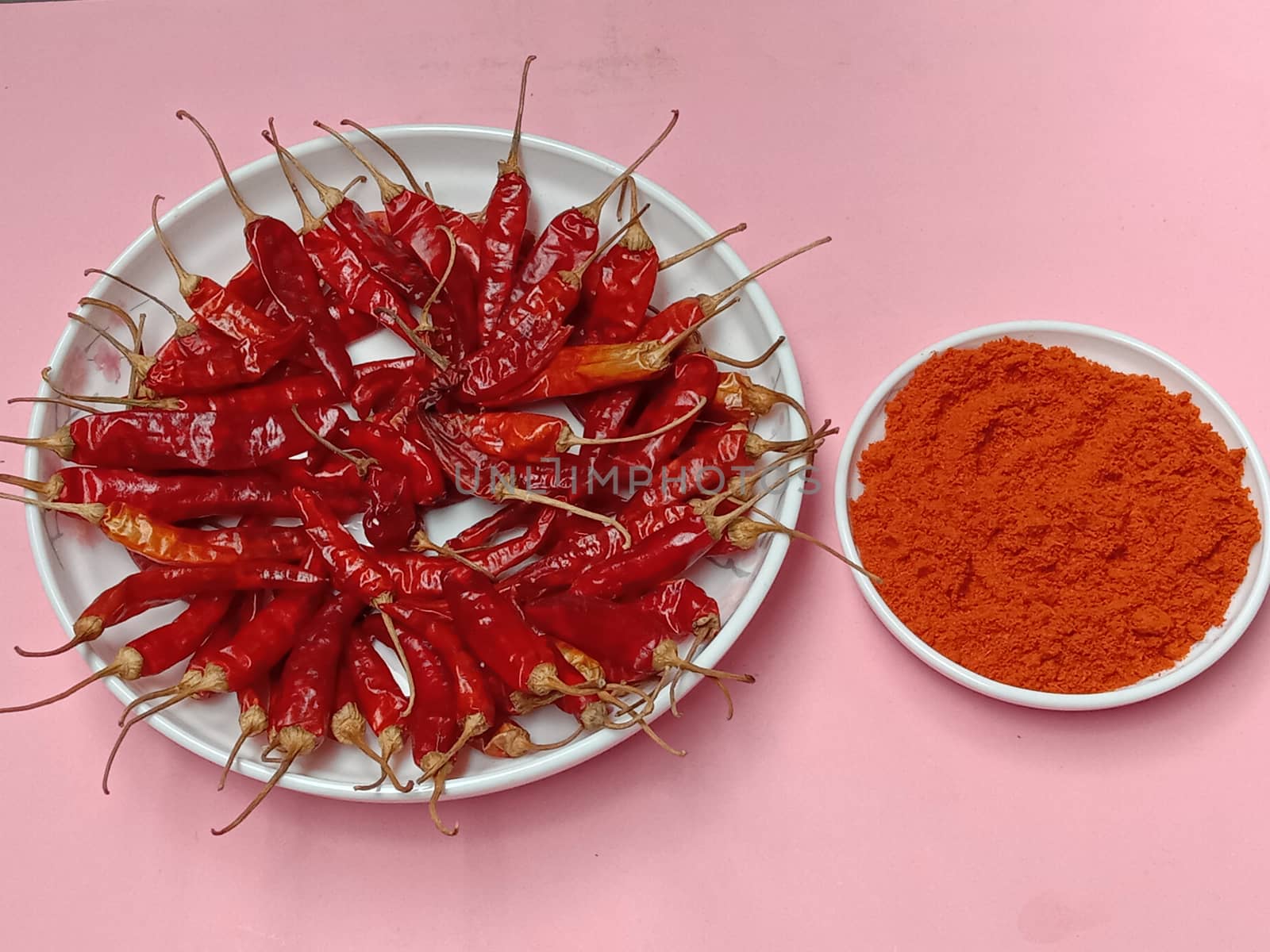 spicy and hot Red Dry Red Chilli stock and powder on bowl