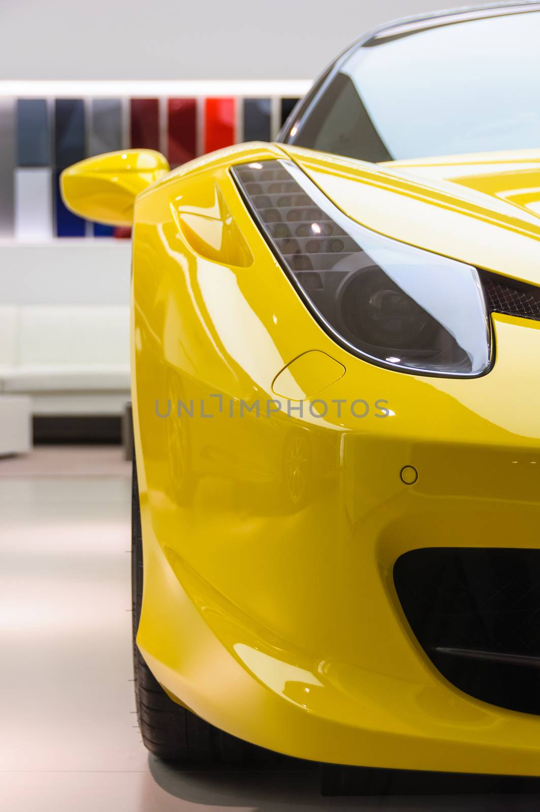 Yellow Ferrari 458 Italia in showroom