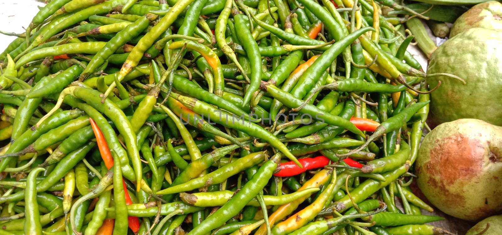 healthy and spicy and hot green chilli stock on bowl