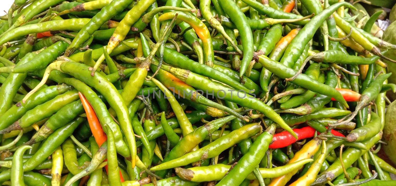 healthy and spicy and hot green chilli stock on bowl